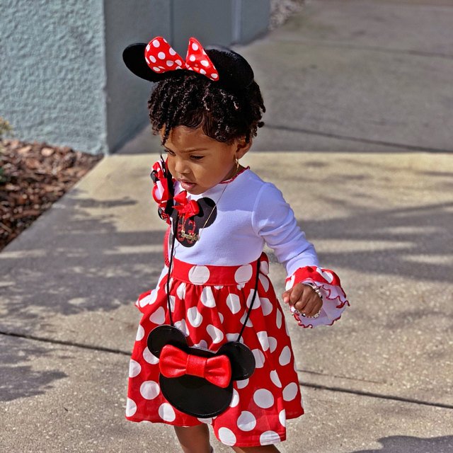 Little Girl Wearing A Minnie Mouse Dress 