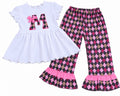 Girls personalized outfit with white ruffle top, argyle initial applique with pink bow, and pink and gray argyle ruffle pants
