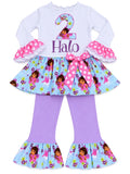 A toddler girl's two-piece Dora the Explorer themed outfit featuring a white long sleeve top with a '2 Halo' graphic, a light blue ruffled skirt with Dora prints, and lavender flare leggings with matching ruffled hems.