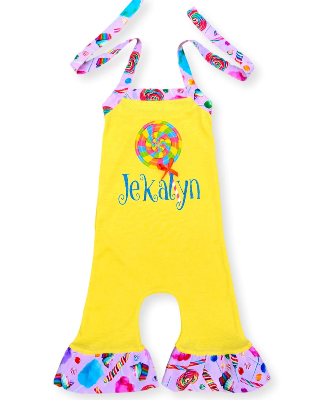 A yellow knit romper with a lollipop design and the name 'Jekalyn' printed on the front.