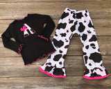 Cow print pants and tee